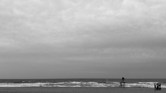 Beach Scene with sand and sky and crashing waves